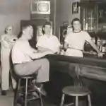 Picture of men in a tavern with small black and white TV circa 1950s